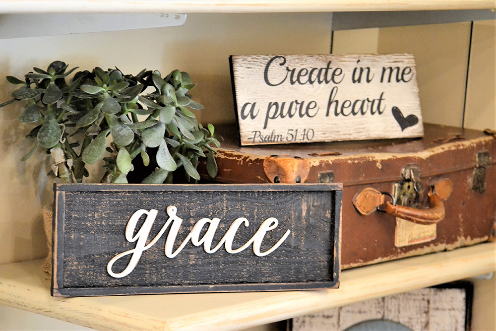 A picture of decorative wood panels with the words grace and create in me a pure heart Psalm 51:10