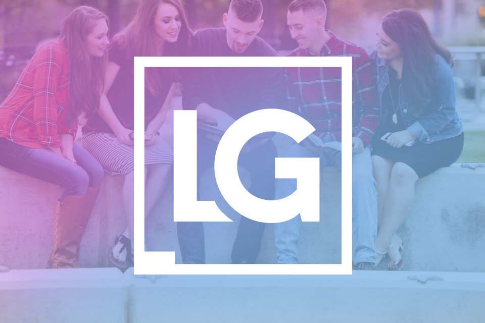 A picture of people with the LG logo in front